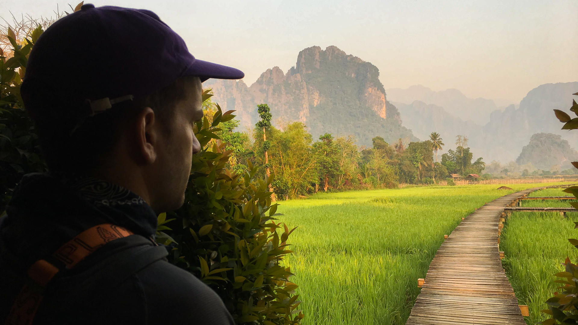 Samuel Haddad looks out across a mountainous landscape in Vientiane, Laos.