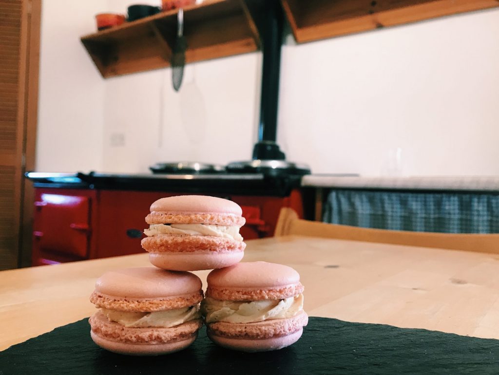 Three macaroons on a table.