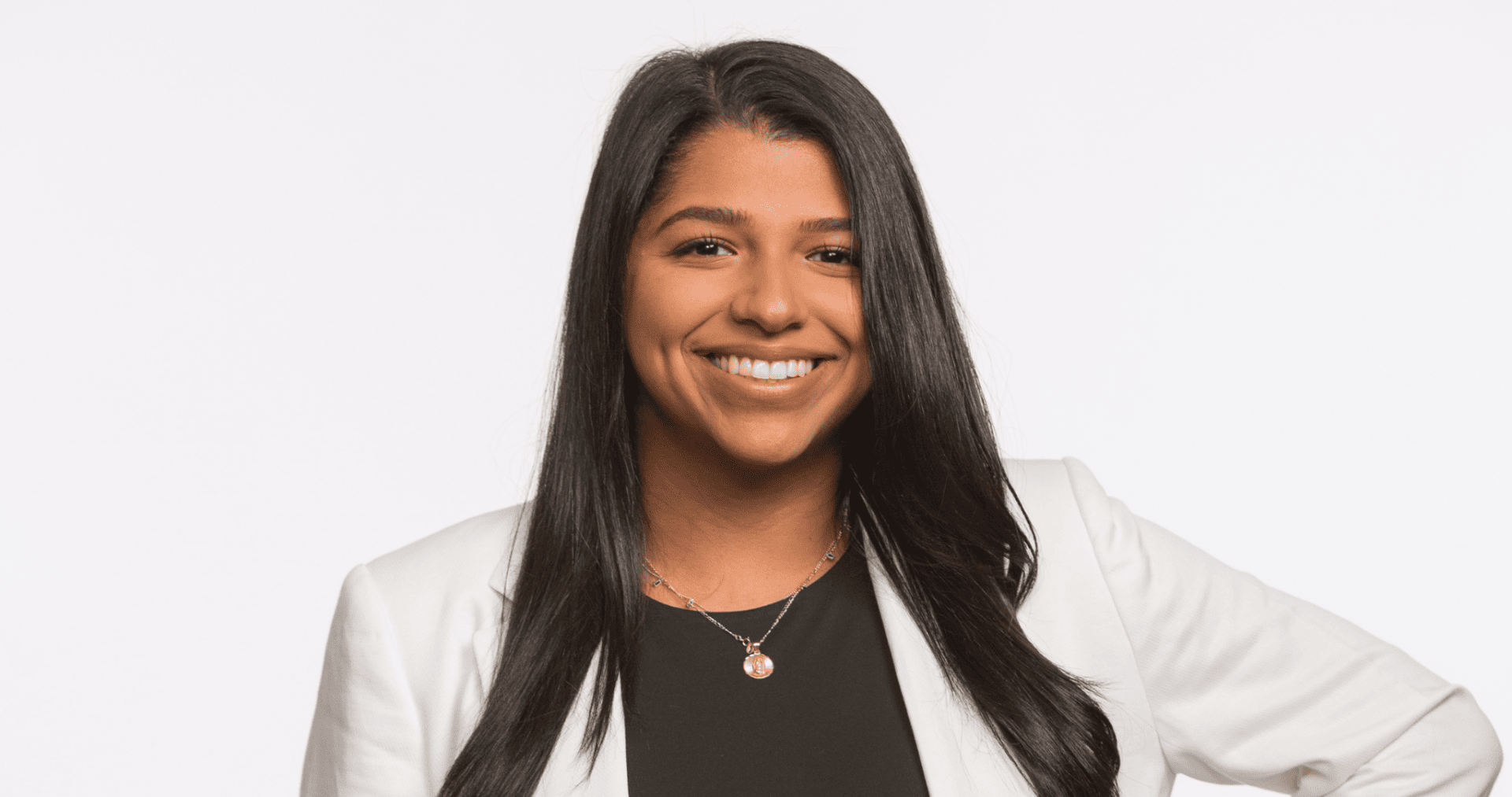 Amalia Mamolejos in a white blazer and black top