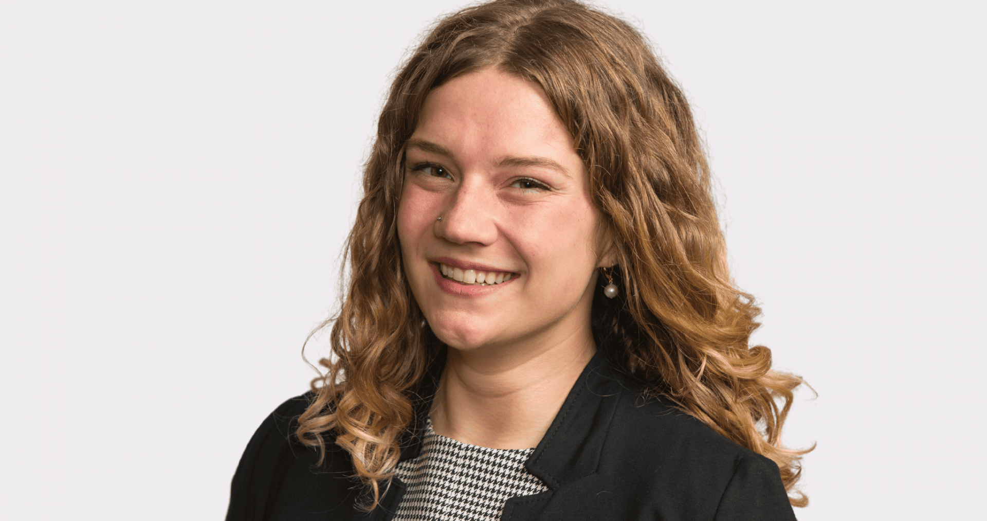 Oliva Romine in a black blazer