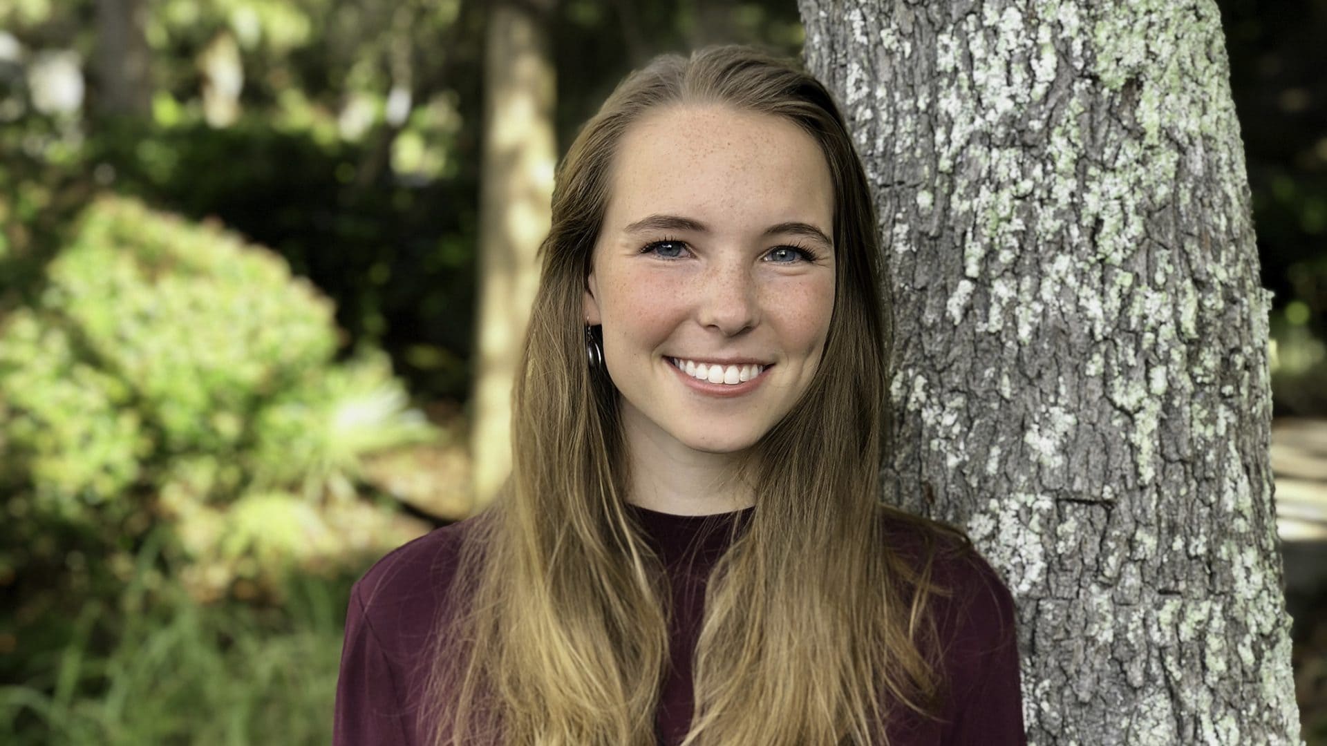 Headshot of Ashley Wade ’22 in front of a tree.