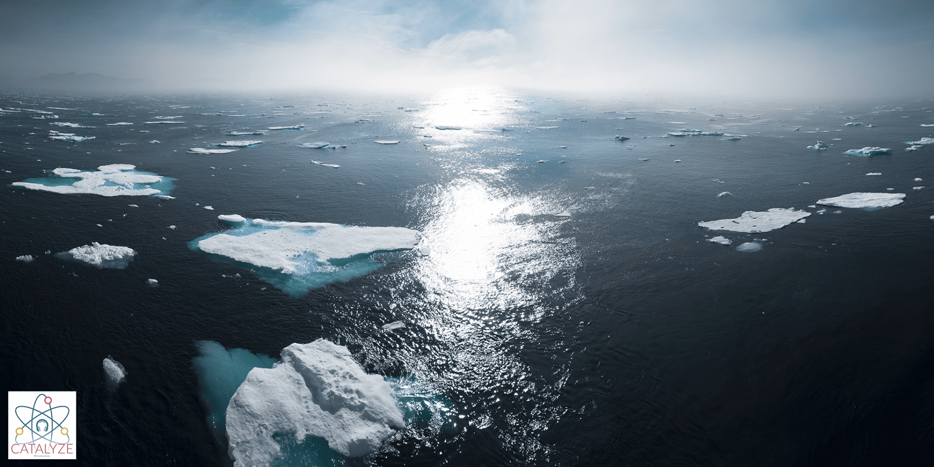 The sun shines on water and broken ice.