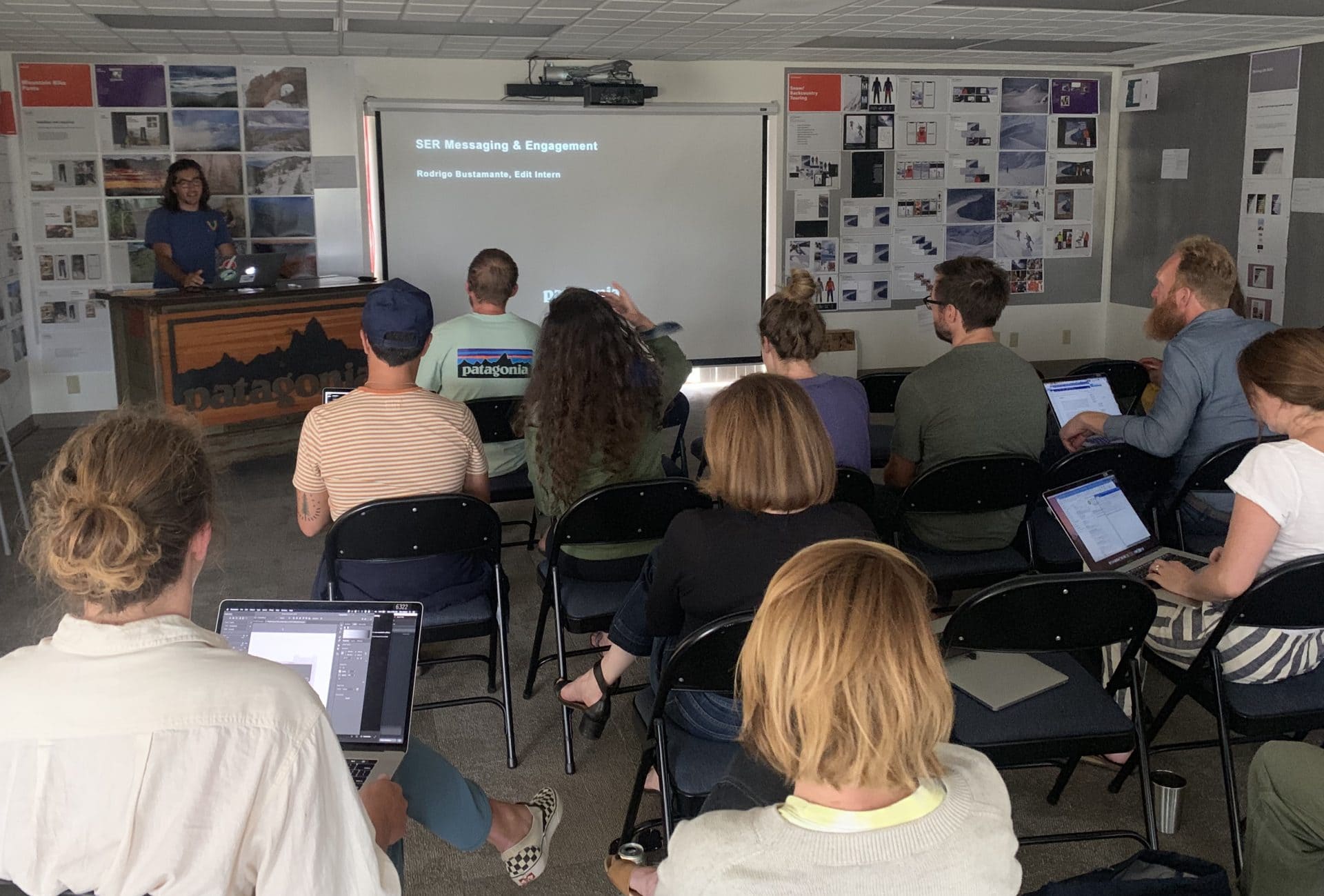 Rodrigo presents his findings to the Patagonia staff in a conference room.