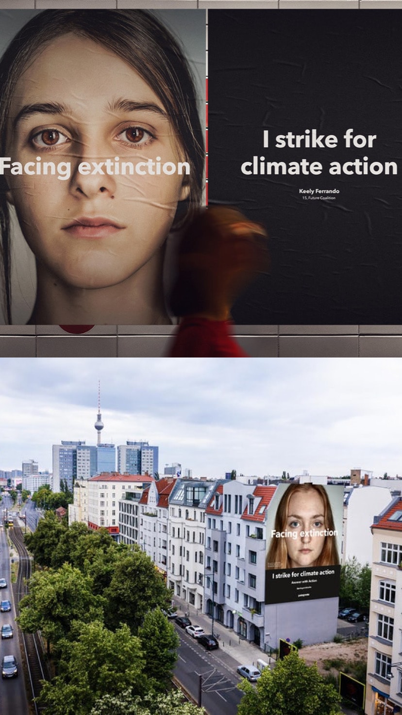 Street view of building advertisements which say: "Facing extinction" and "I strike for climate action."