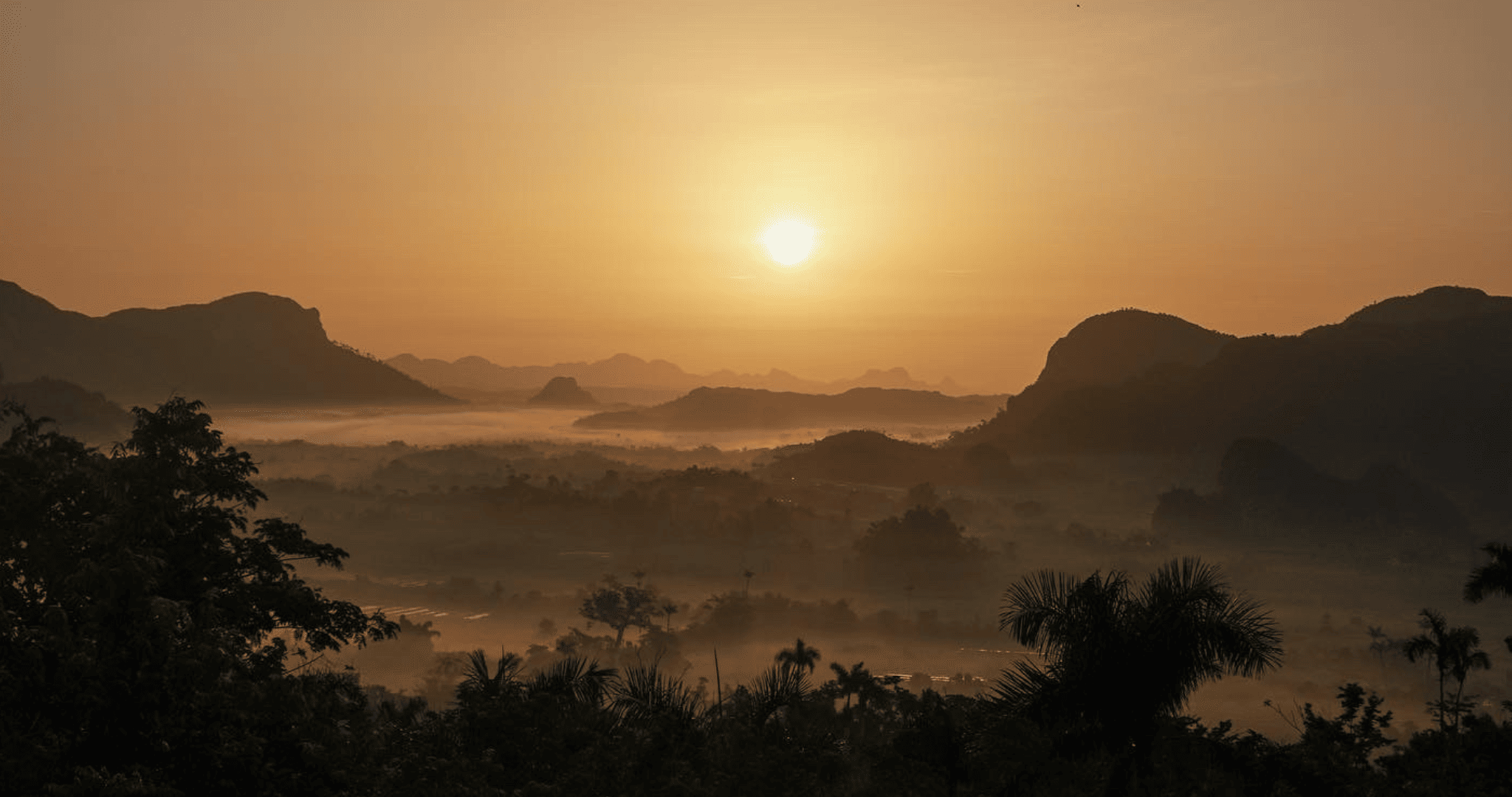 Mountains and trees at sunset in Havana.
