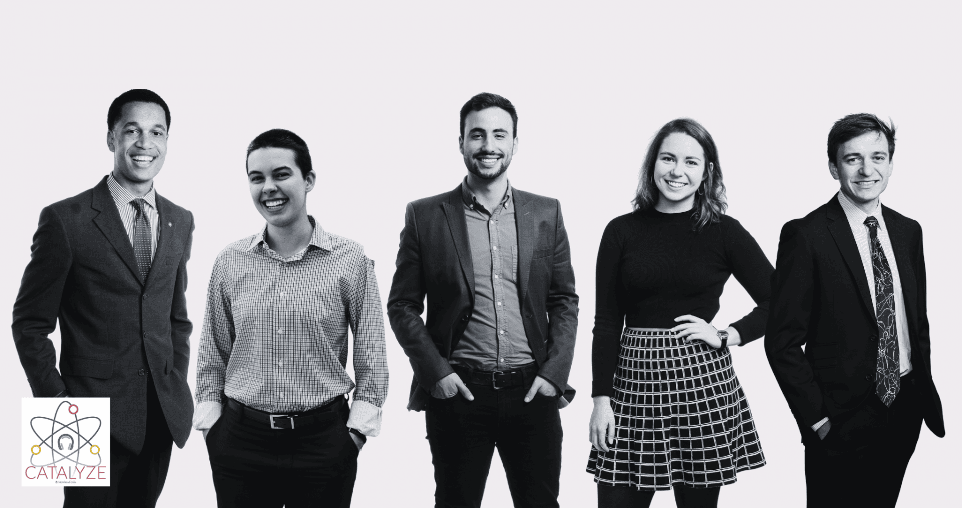 Five alumni smile for the camera wearing business attire.