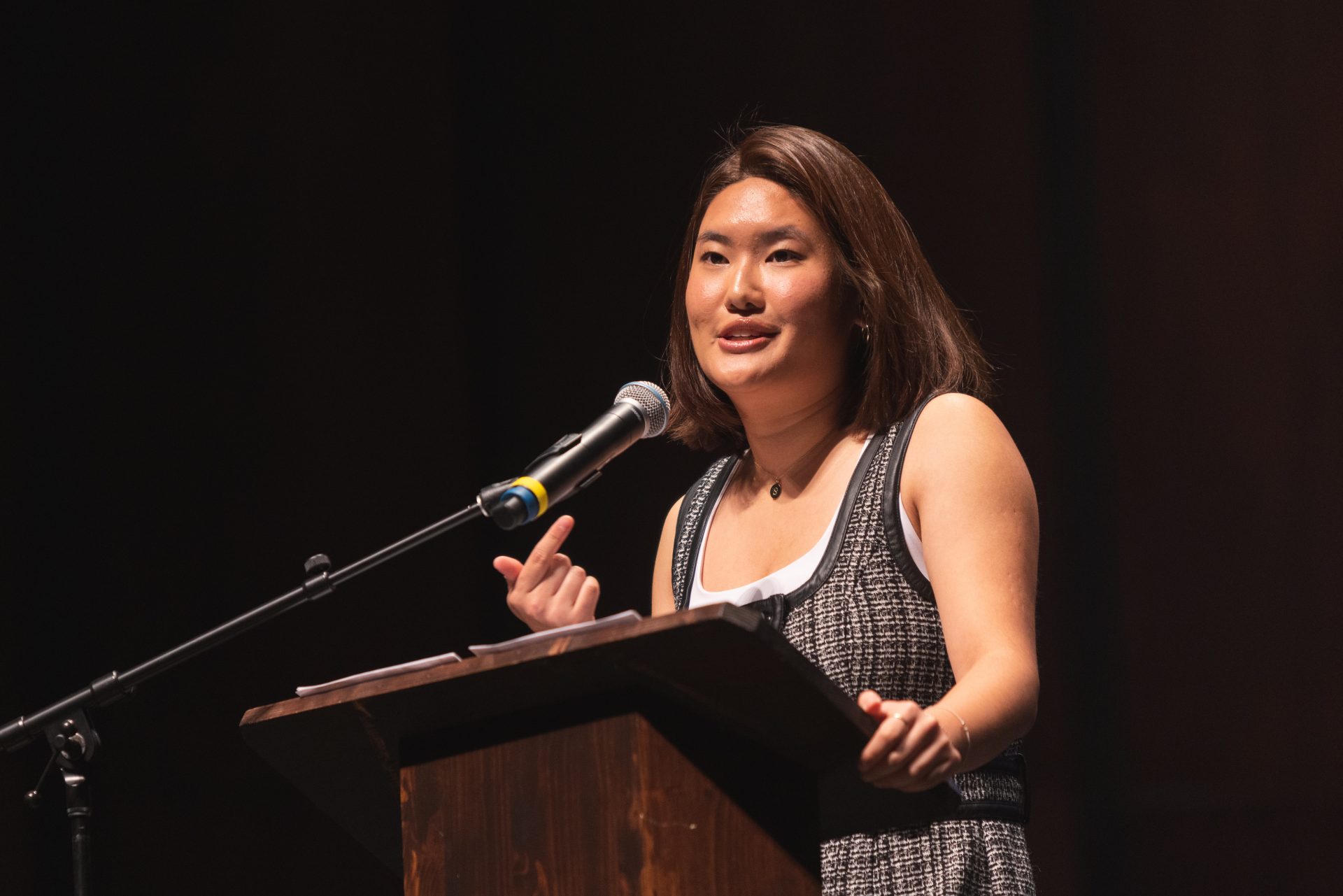 Sophie Cho speaking behind a podium