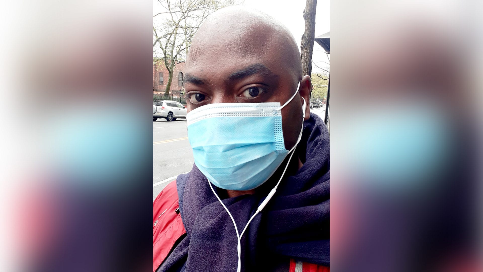 Selfie of Bryan Crumpler ’01 wearing a medical face mask. He is standing outside in New York.