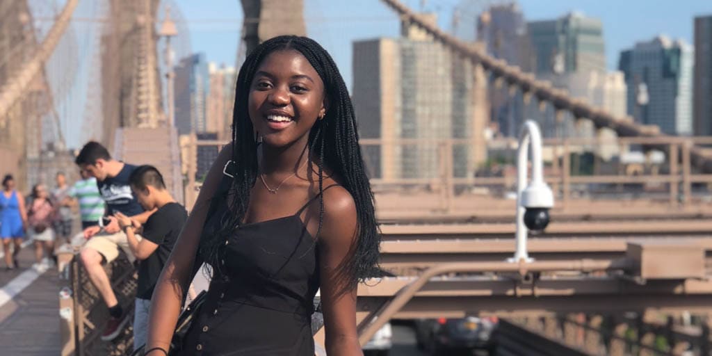 Thokozile smiles on Brooklyn Bridge.