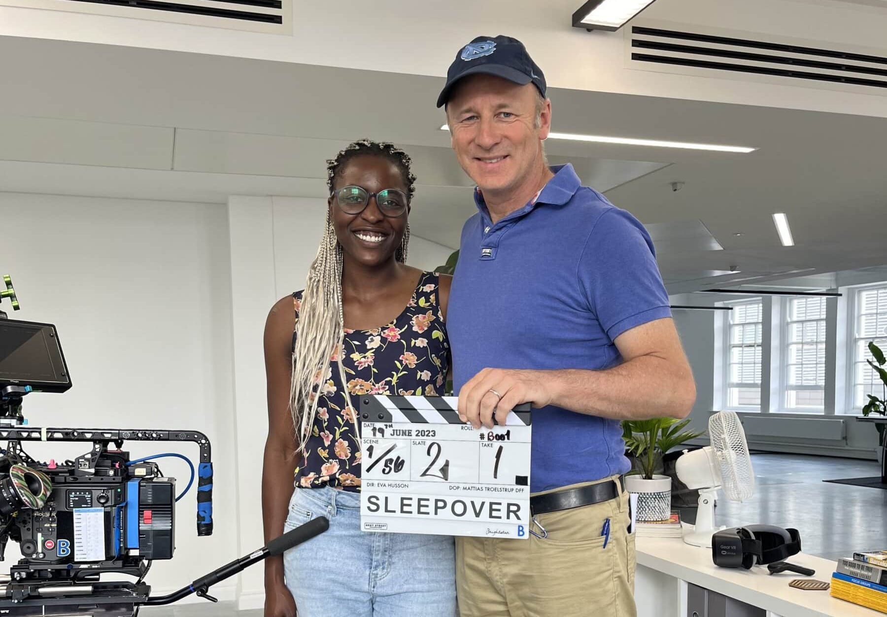 two people smiling and posing for a photo