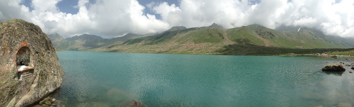 A view of of a large body of water with mountains in the background.