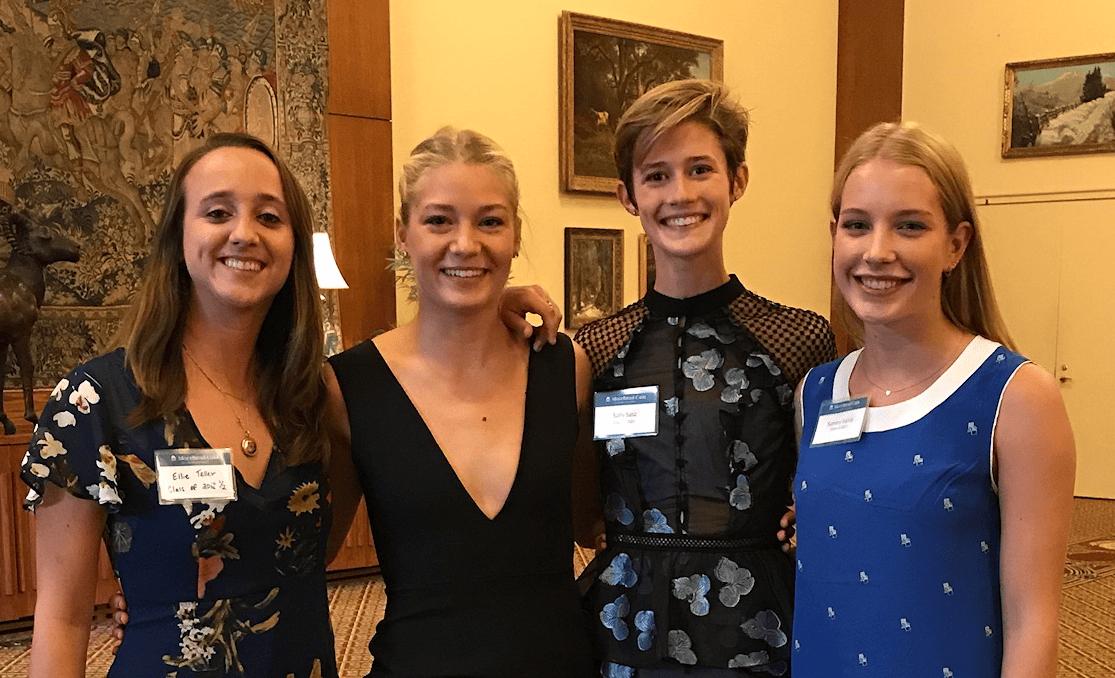 Group photo of Sally Sasz ’21 standing besides Sammy Ferris ’22 and two other scholars.