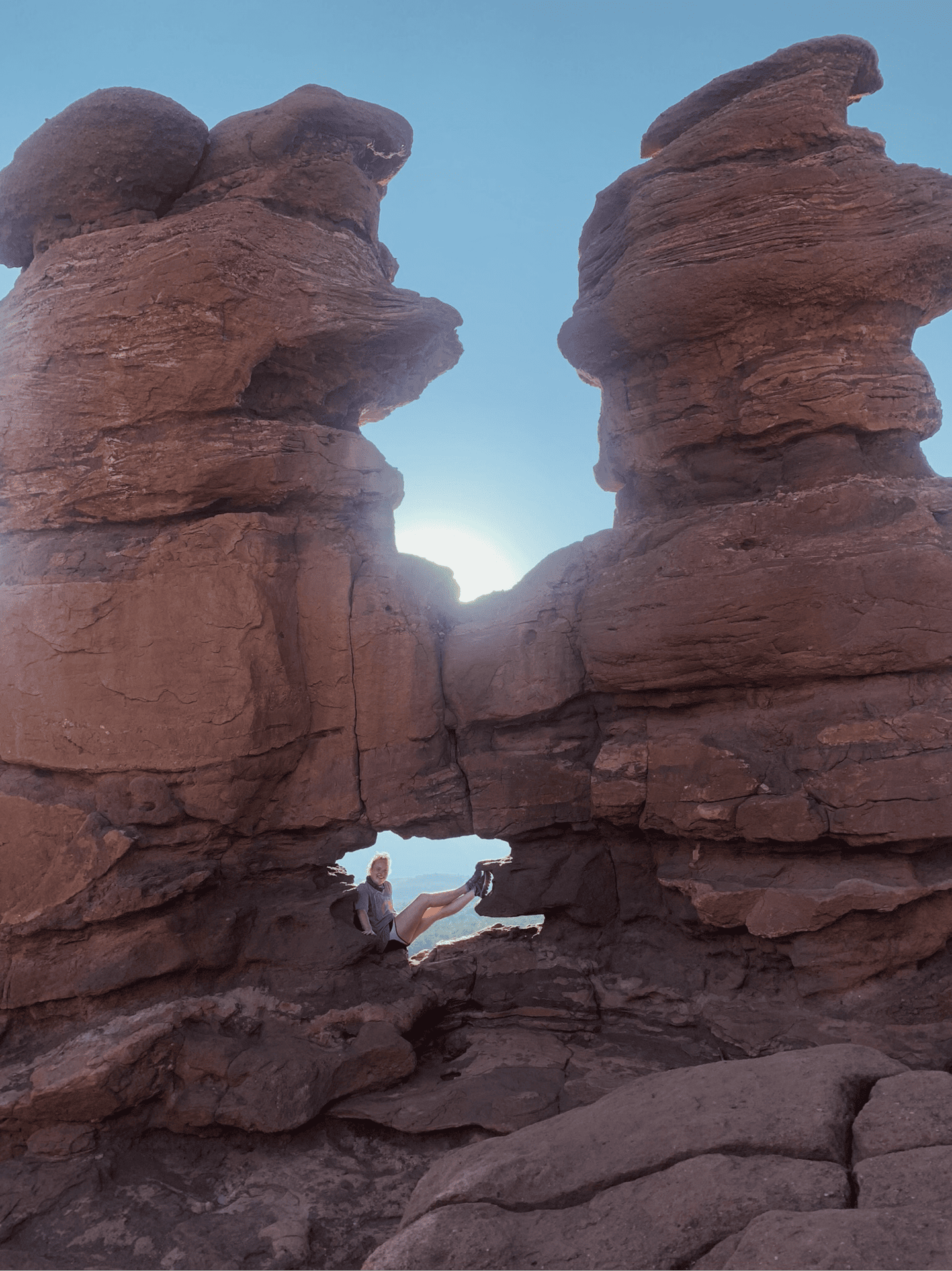 Virginia sits perched in a rocky crevice.