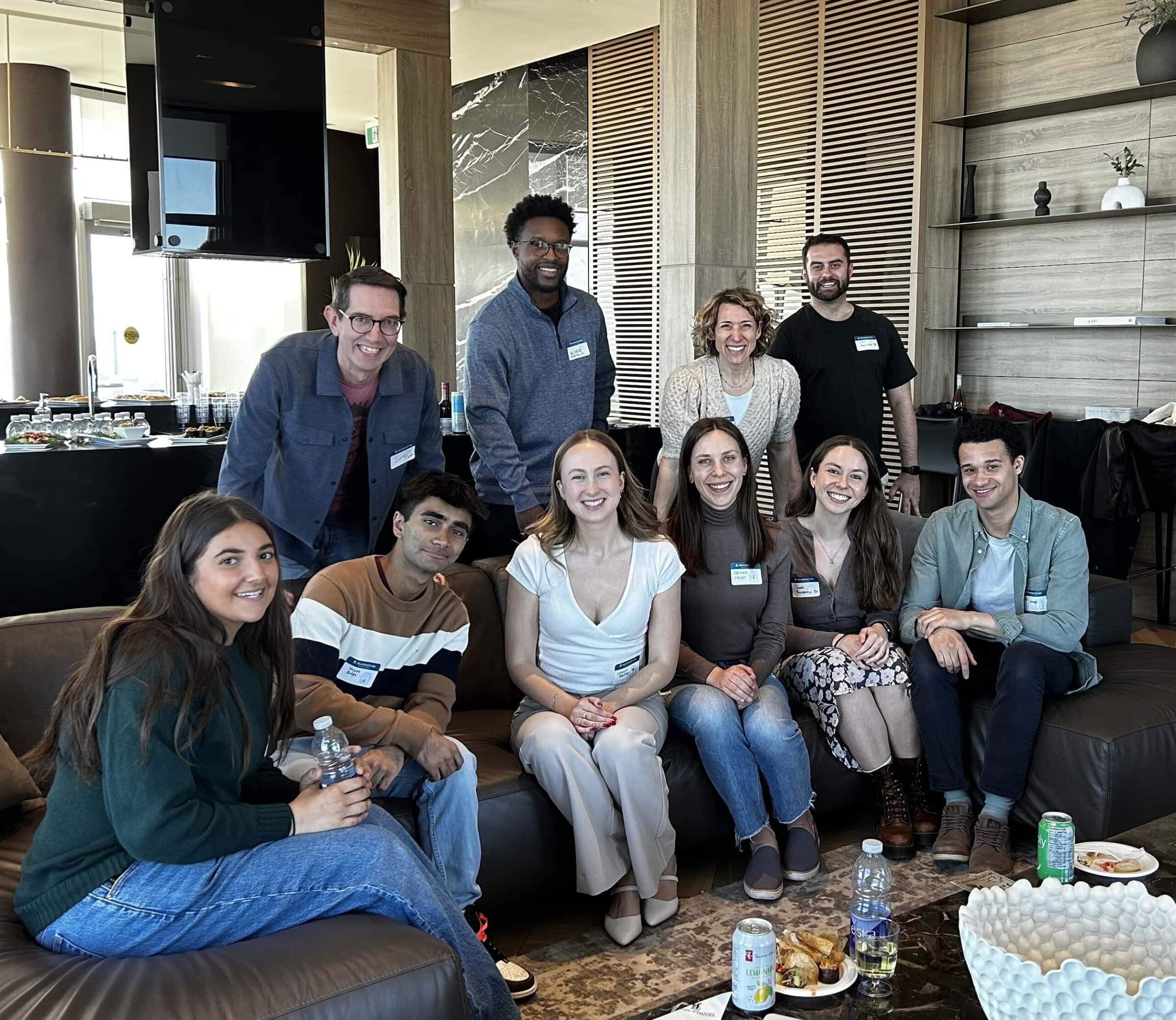 Group of scholars and alumni gather for a photo