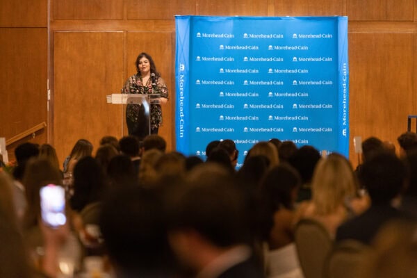 Speaker on stage looking at crowd