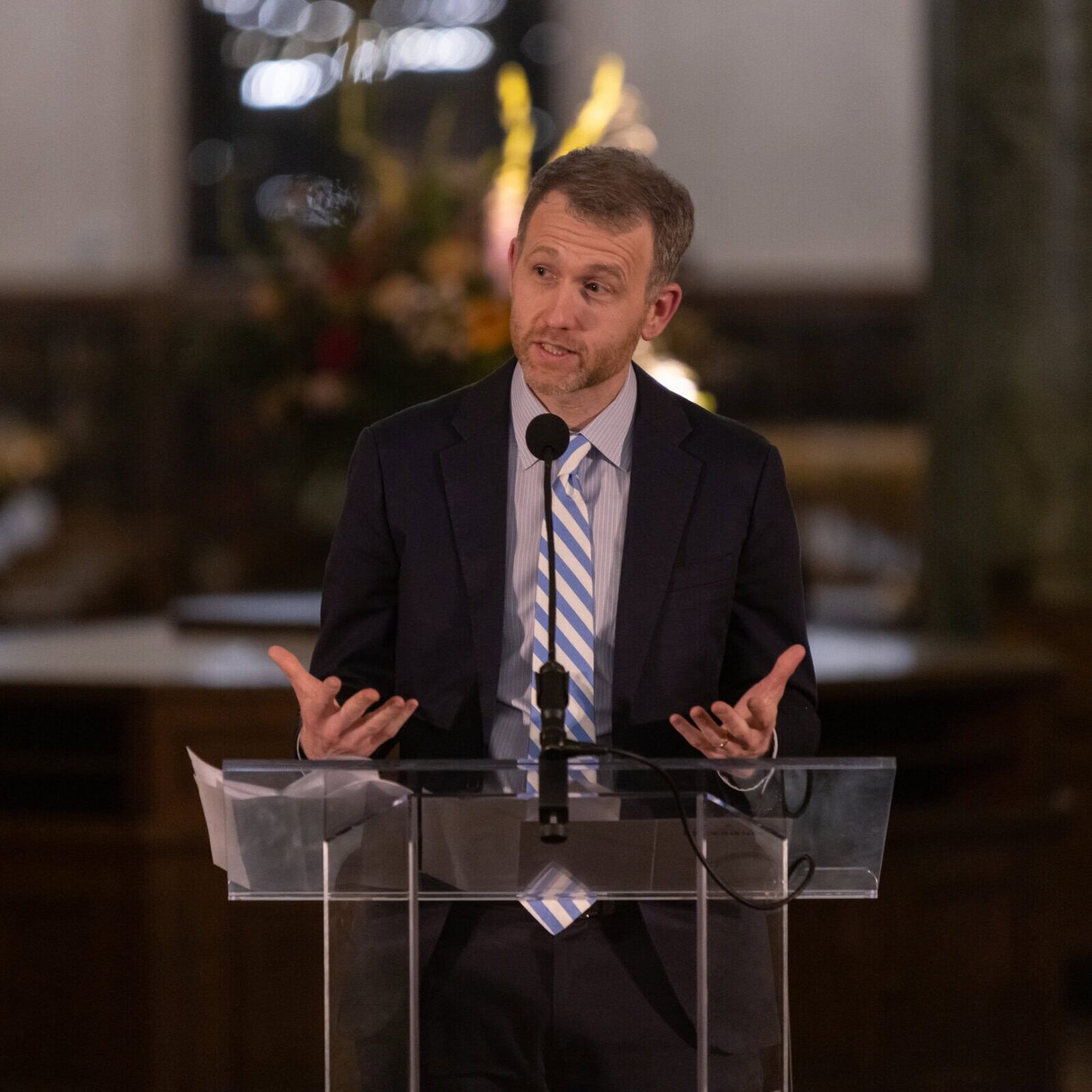 A man standing at a podium giving a speech