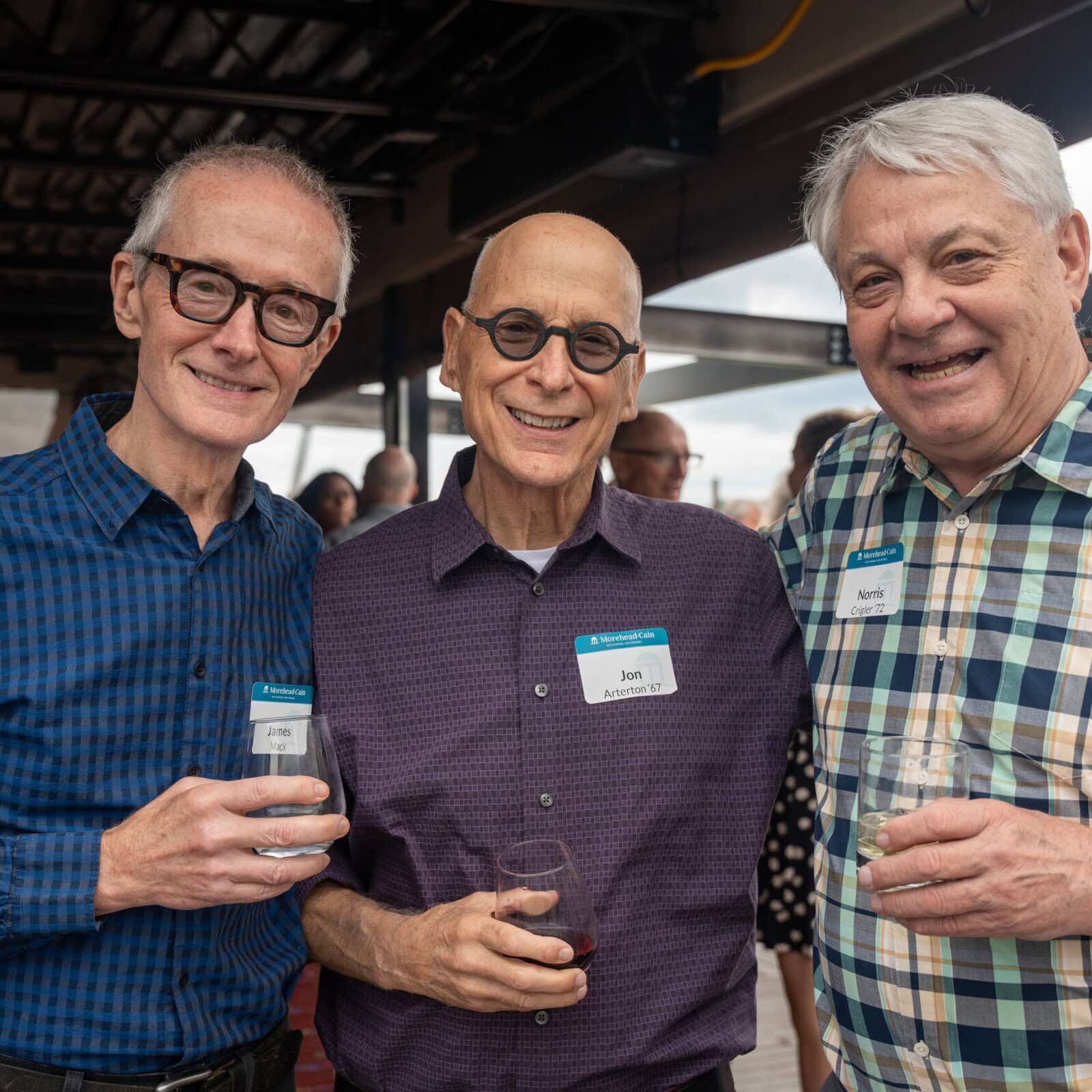 Three Morehead-Cain alumni at an event
